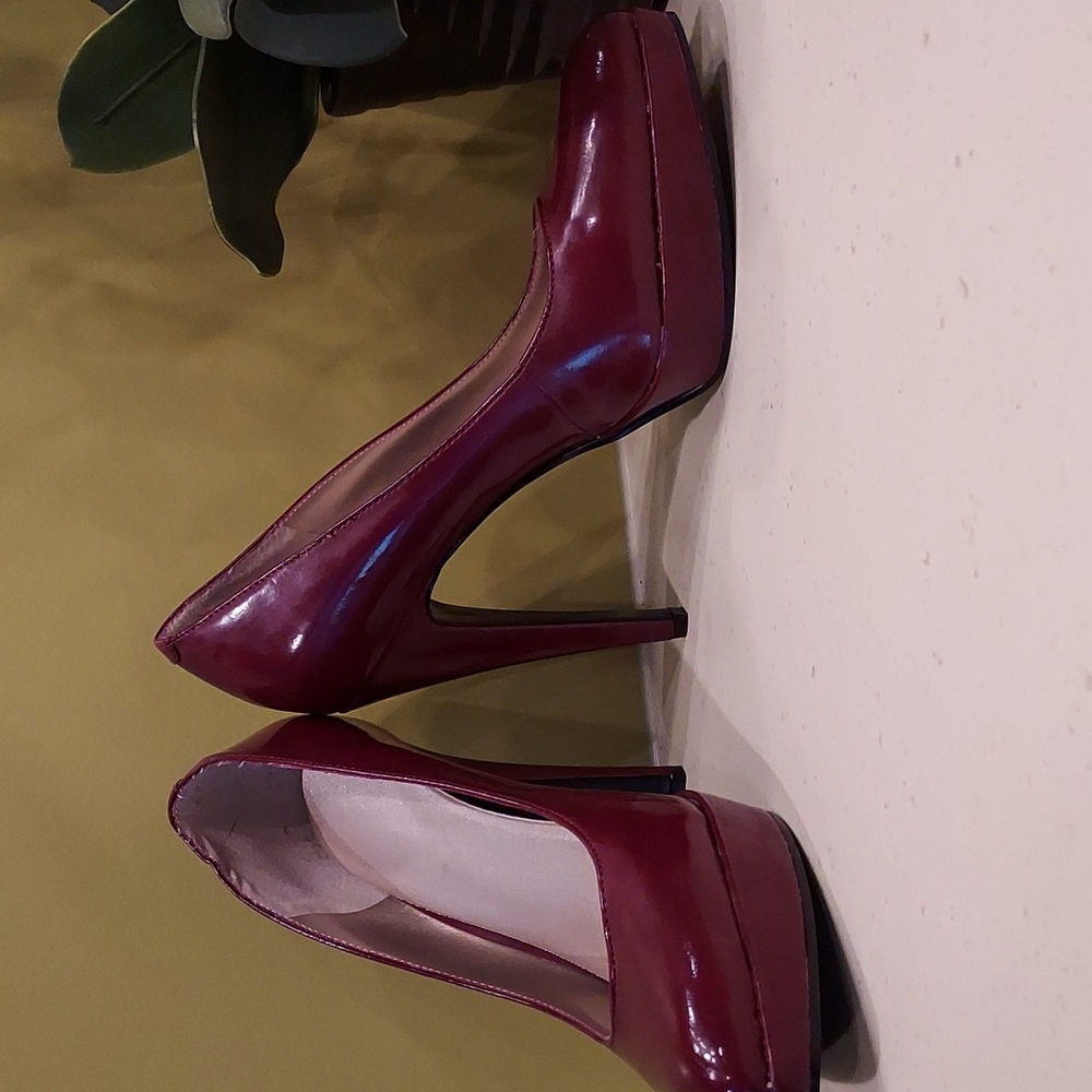 Nine West on the edge.  Dk red patent leather heels. 6.5